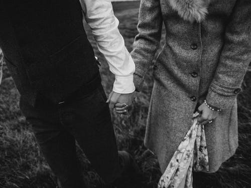 Monochrome Photo Of People Holding Hands