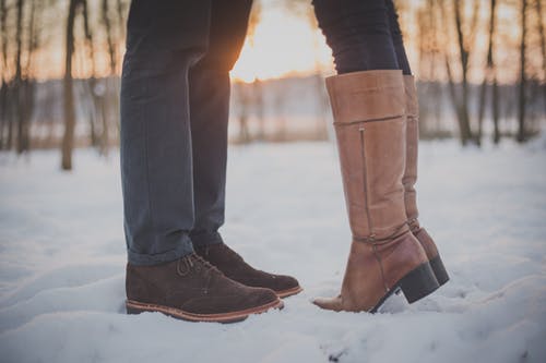 Two People Standing on Snow