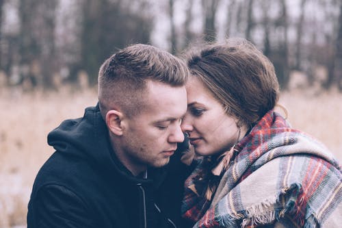 Man Sitting Beside Woman