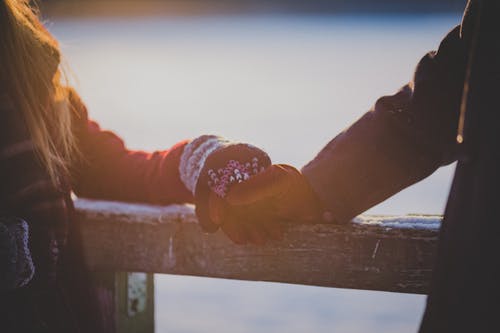 Man and Woman Hands in Shallow Photo